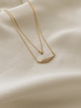 Golden feather necklace