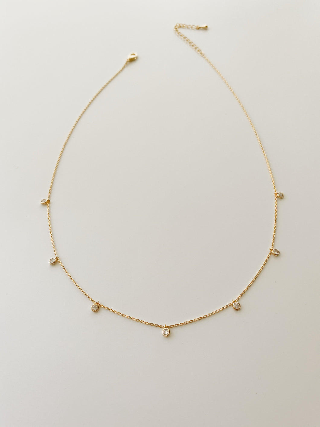 Gold bezel-set CZ necklace