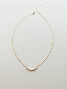 Curved gold CZ bar necklace