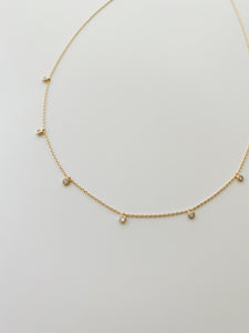 Gold bezel-set CZ necklace